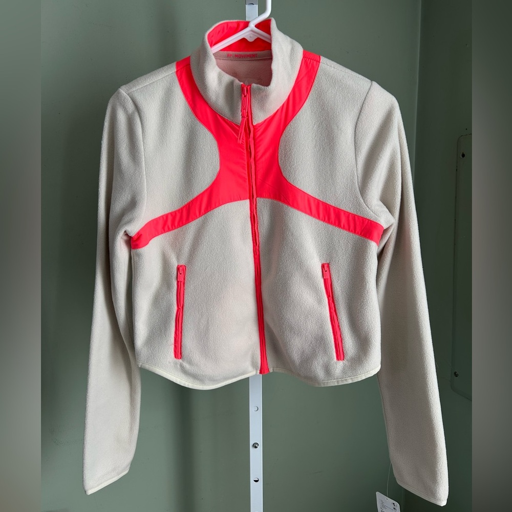 Free People bone colored fleece jacket with orange
Accents